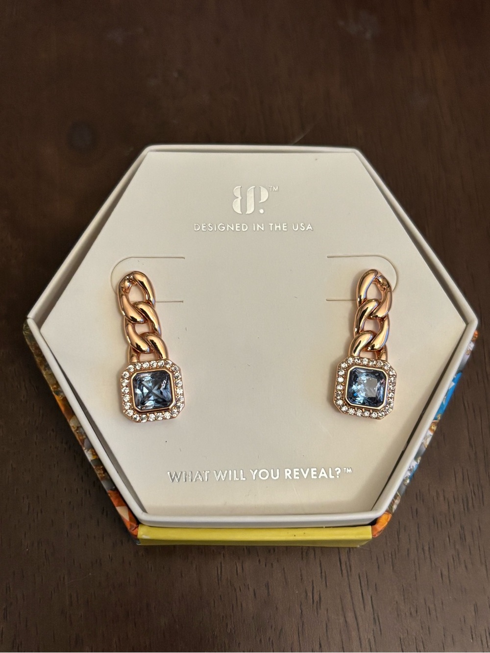 BNIB rose gold plated earrings with lab created blue topaz